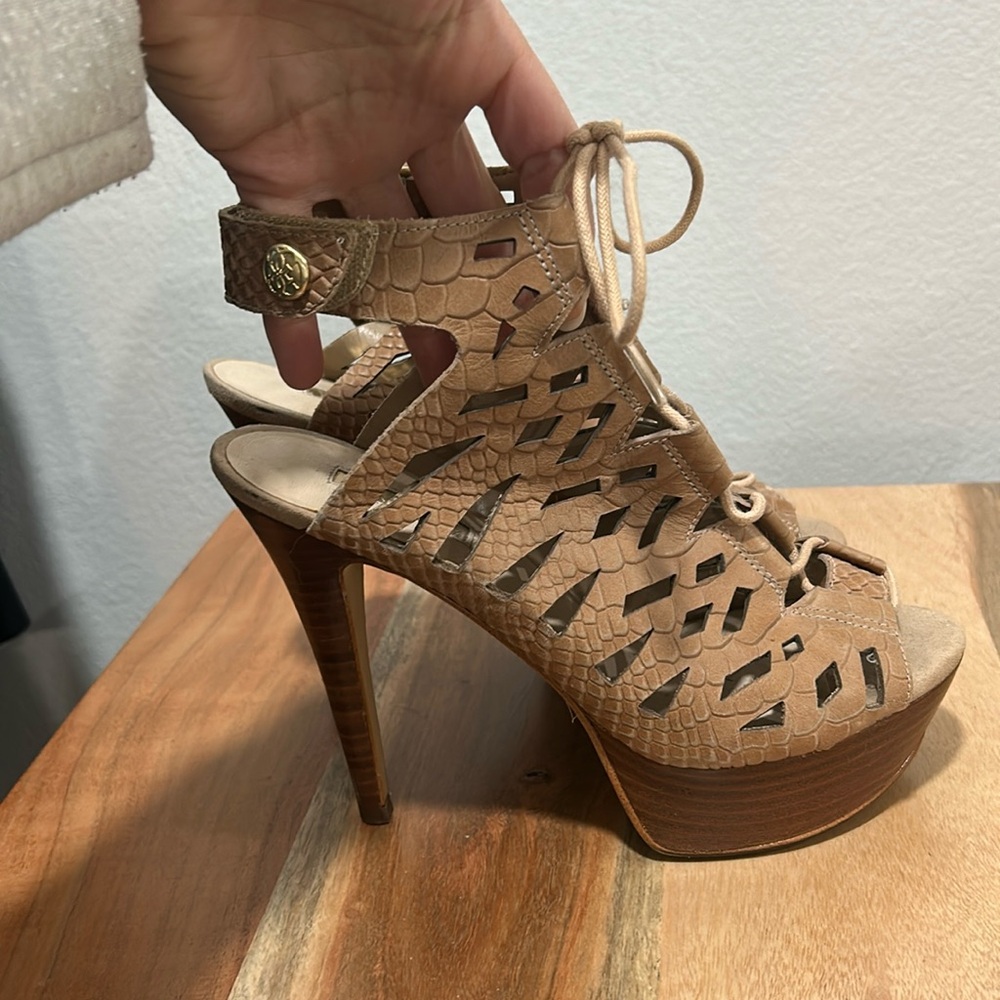 Guess heels. Worn once minor flaws.
